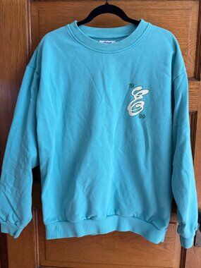Enchanté F1 crewneck sweatshirt in a vibrant aqua blue color, Large